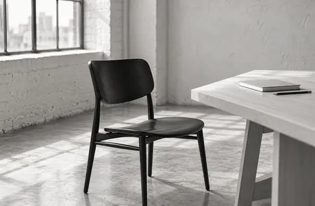 An empty chair at a studio desk, waiting for the next hire