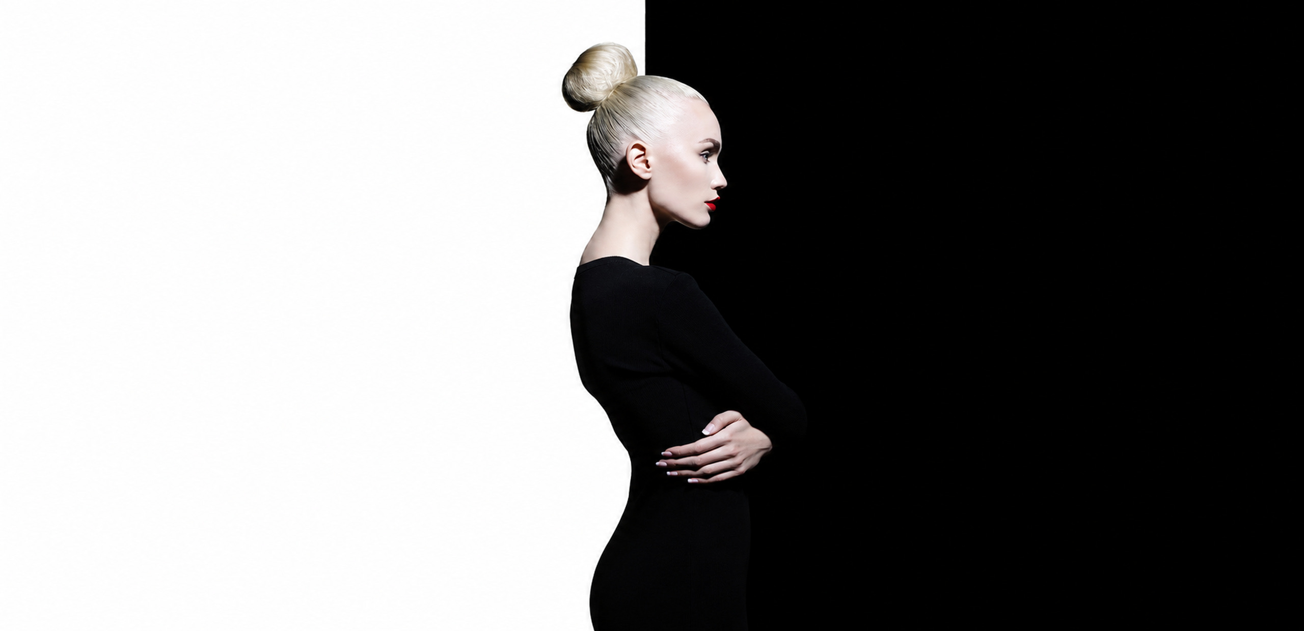 Model in profile on a white and black background